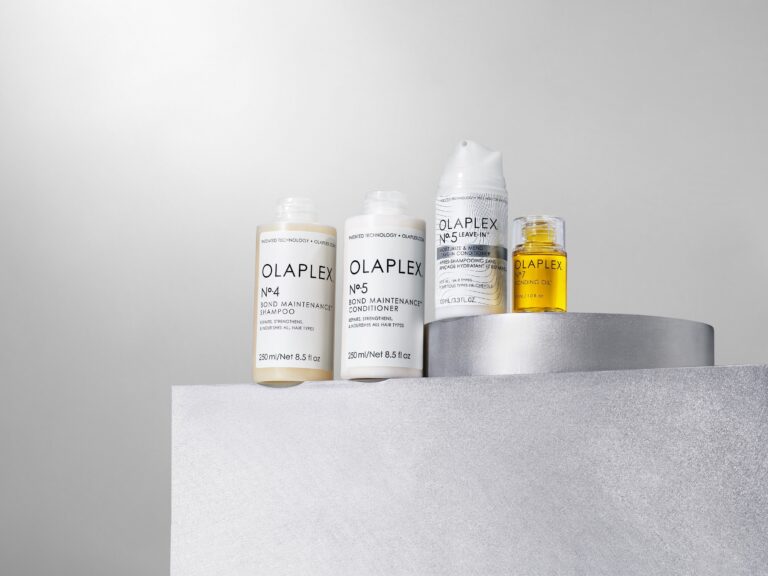 OLAPLEX products grouped together on a pedestal